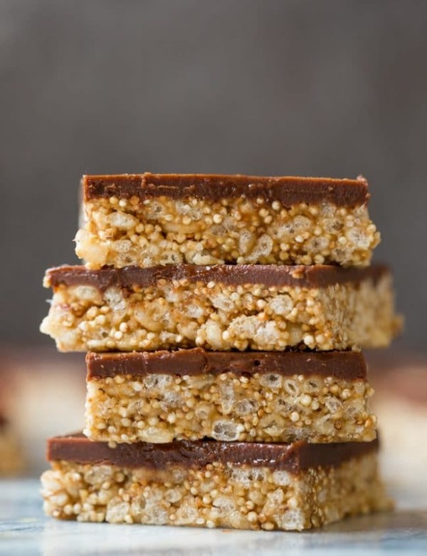 4 Toasted Quinoa Peanut Butter Scotcharoos stacked on top of each other