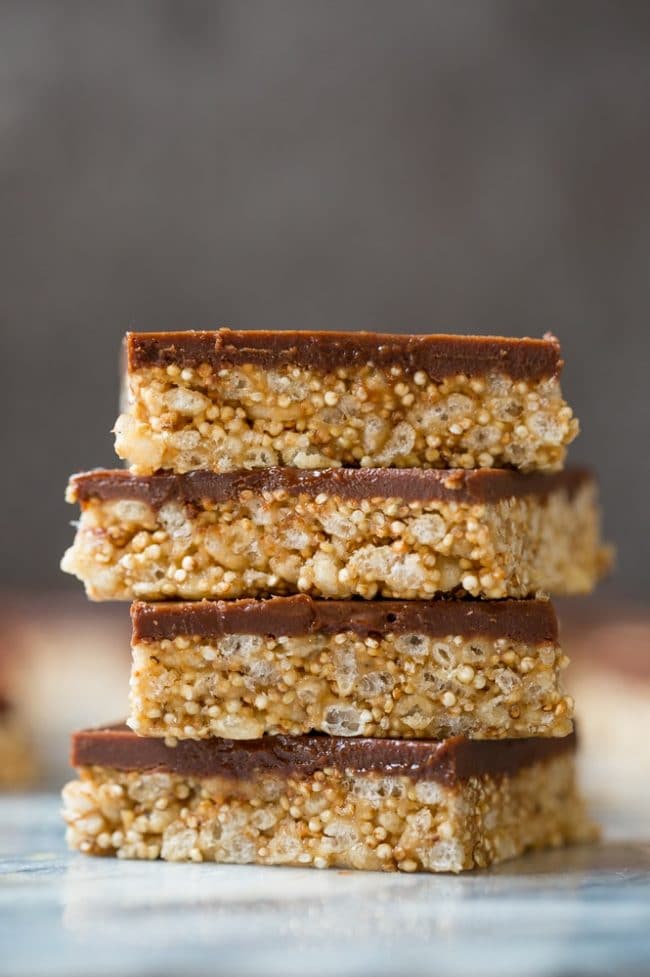 4 Toasted Quinoa Peanut Butter Scotcharoos stacked on top of each other