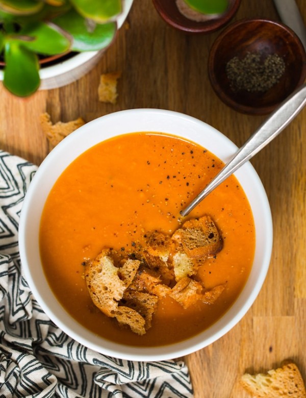 Instant Pot Tomato Soup in a bowl topped with croutons and black pepper
