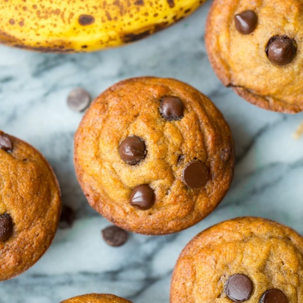paleo banana muffins with chocolate chips on a marble surface