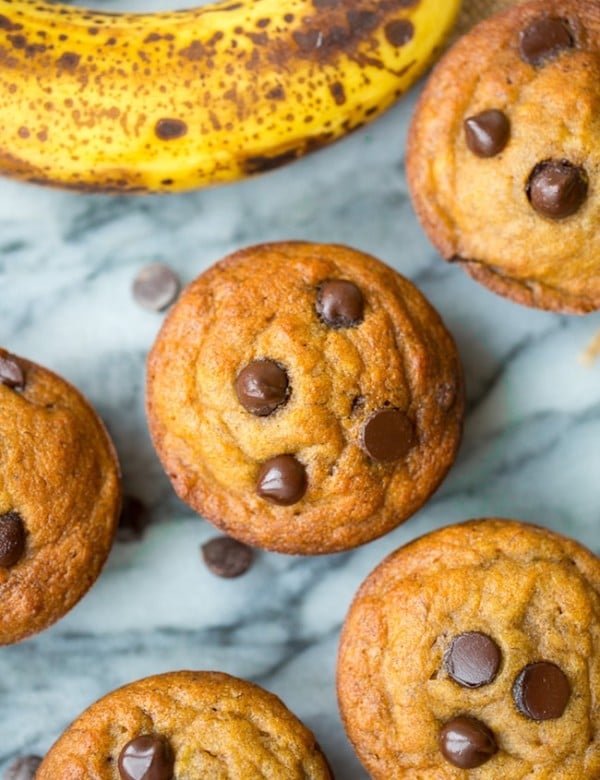 paleo banana muffins with chocolate chips on a marble surface