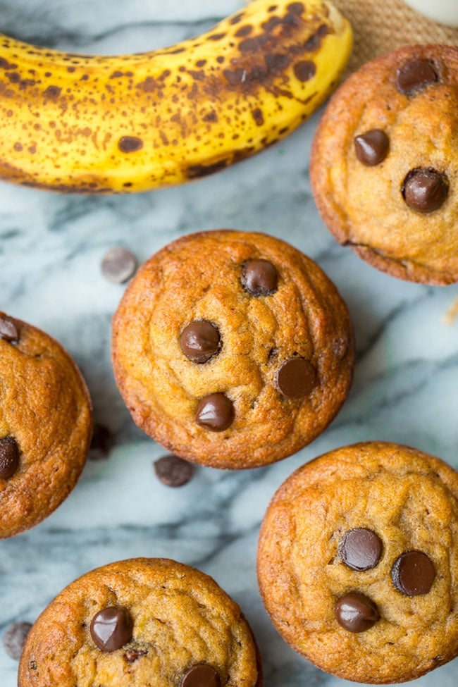 paleo banana muffins with chocolate chips on a marble surface