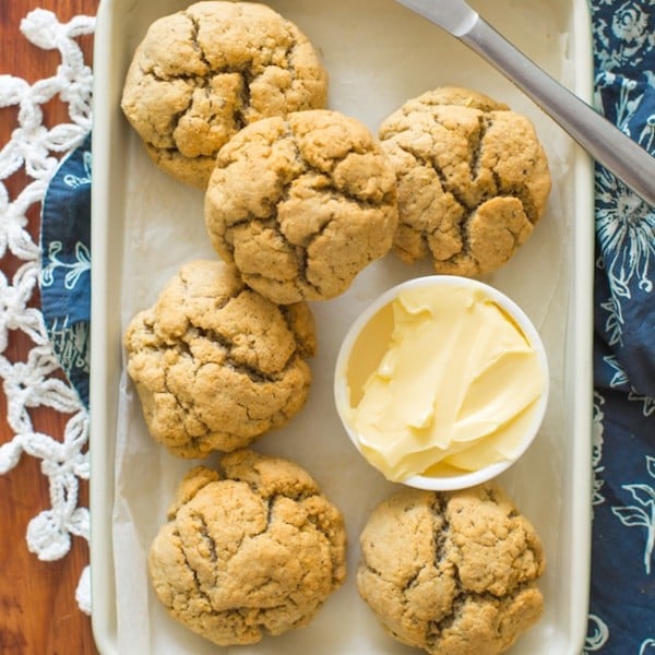 Paleo Dinner Rolls on a baking sheet with butter