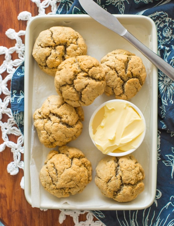 Paleo Dinner Rolls on a baking sheet with butter