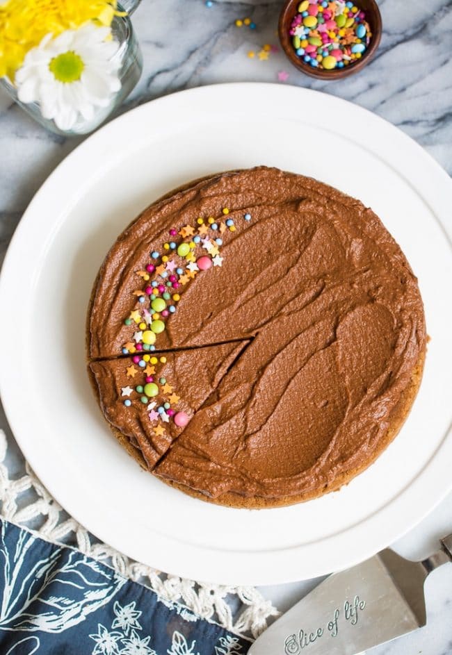 Vegan Coconut Flour Cake on a white plate topped with sprinkles