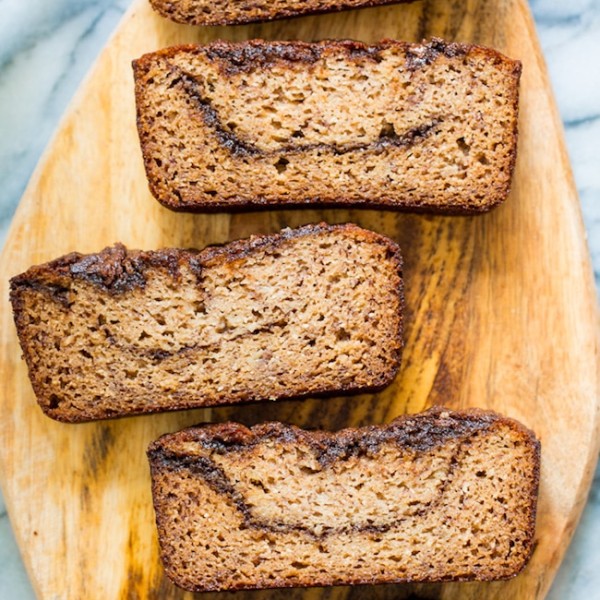 paleo banana bread slices showing off the cinnamon chocolate swirly inside