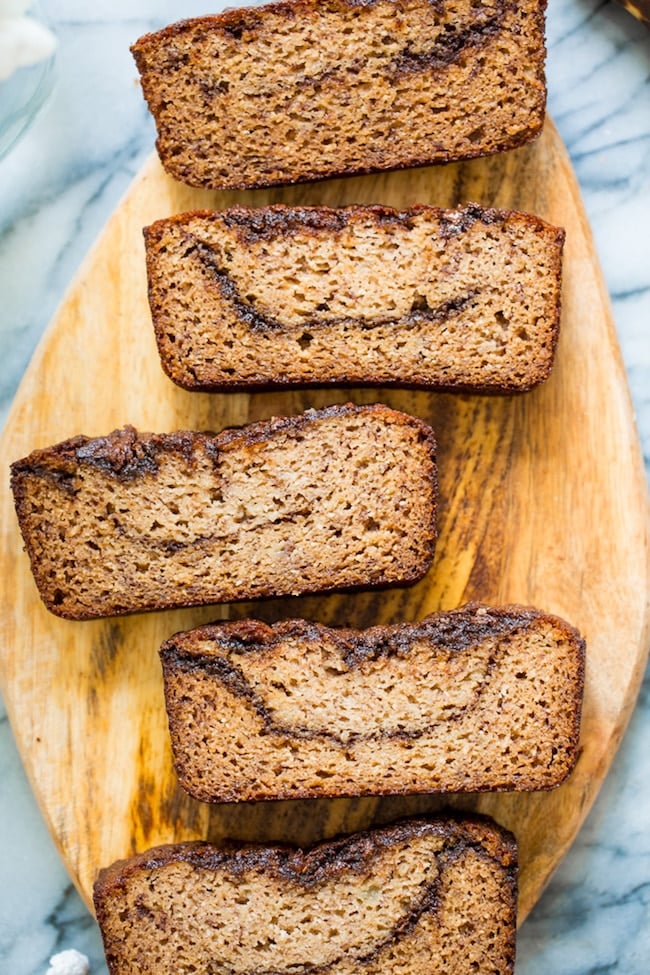 paleo banana bread slices showing off the cinnamon chocolate swirly inside