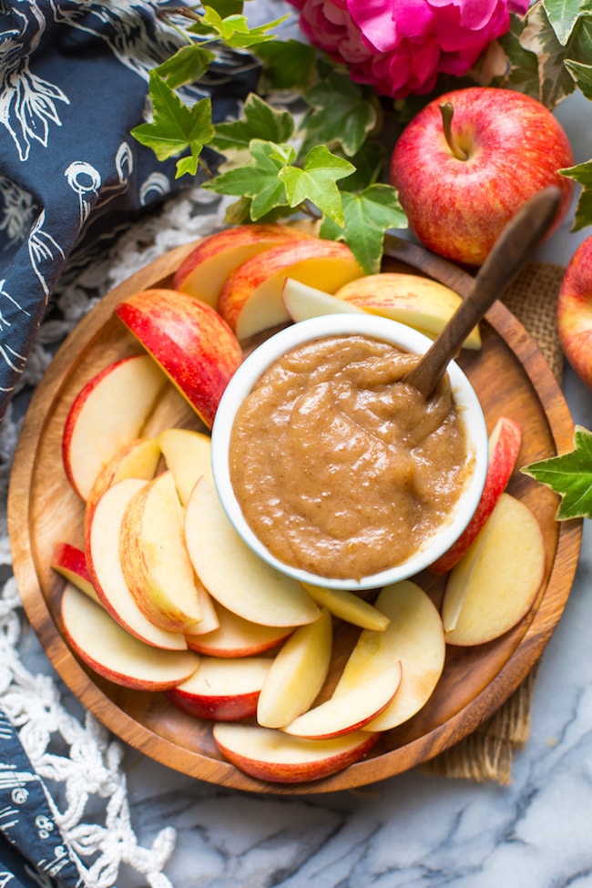 vegan date caramel on a plate with sliced apples 