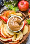 up close look at vegan date caramel on a plate with sliced apples
