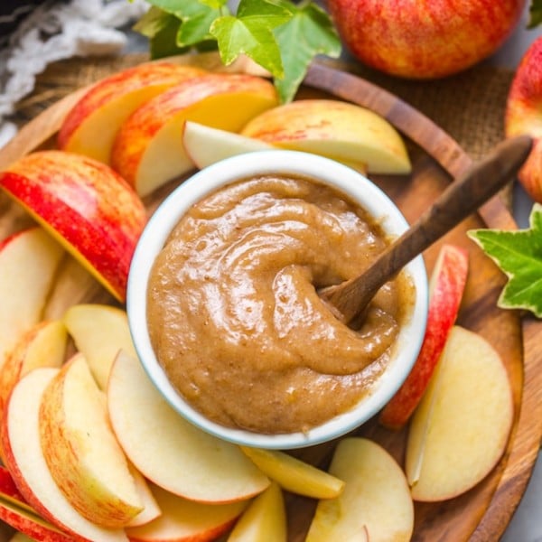 up close look at vegan date caramel on a plate with sliced apples