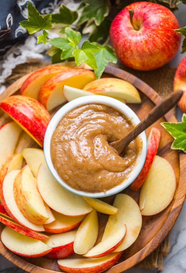 up close look at vegan date caramel on a plate with sliced apples 