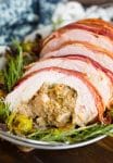 Roasted Turkey Roulade & Fig Sausage Stuffing sliced on a serving plate