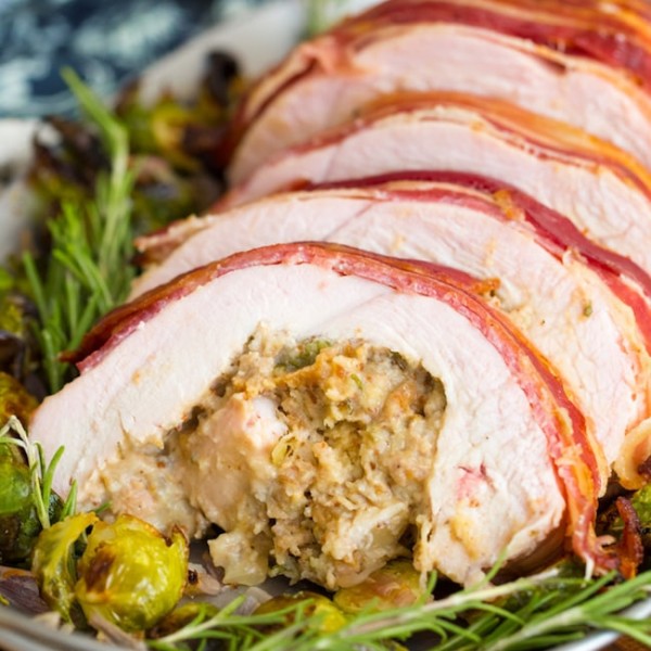 Roasted Turkey Roulade & Fig Sausage Stuffing sliced on a serving plate