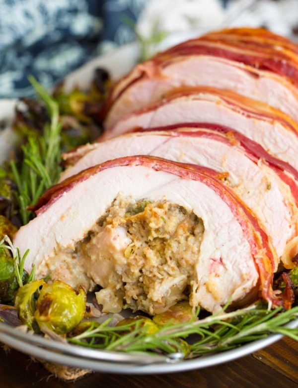 Roasted Turkey Roulade & Fig Sausage Stuffing sliced on a serving plate