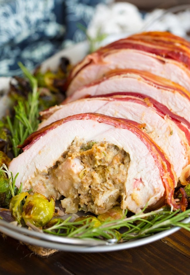 Roasted Turkey Roulade & Fig Sausage Stuffing sliced on a serving plate