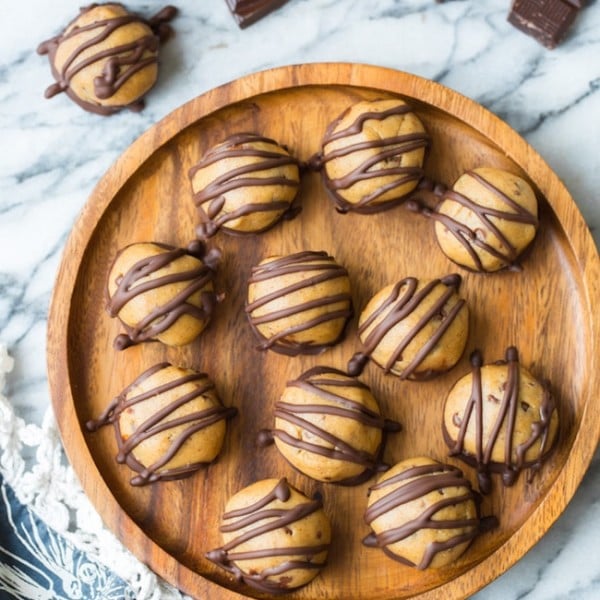 Peanut Butter Cookie Dough Truffles on a wooden plate