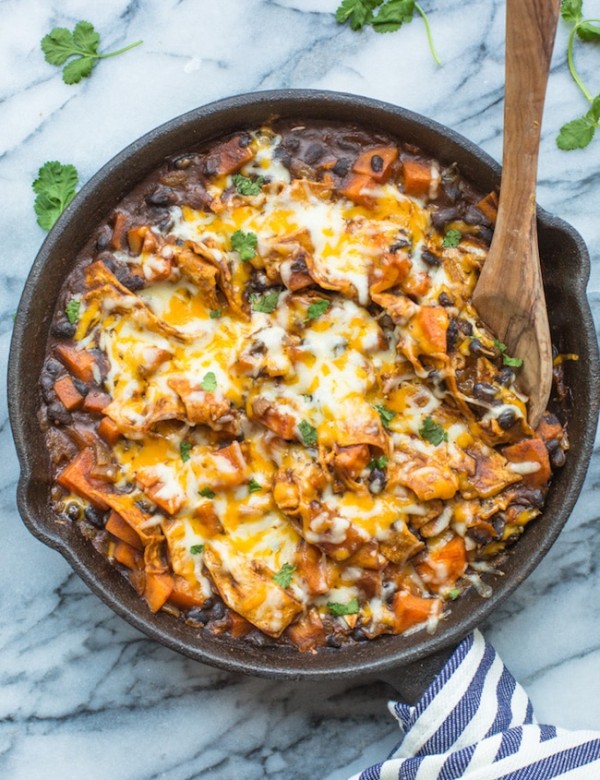 Stove Top Sweet Potato & Black Bean Enchilada Casserole in a skillet topped with cilantro