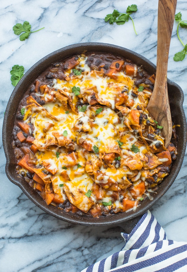 Stove Top Sweet Potato & Black Bean Enchilada Casserole in a skillet topped with cilantro