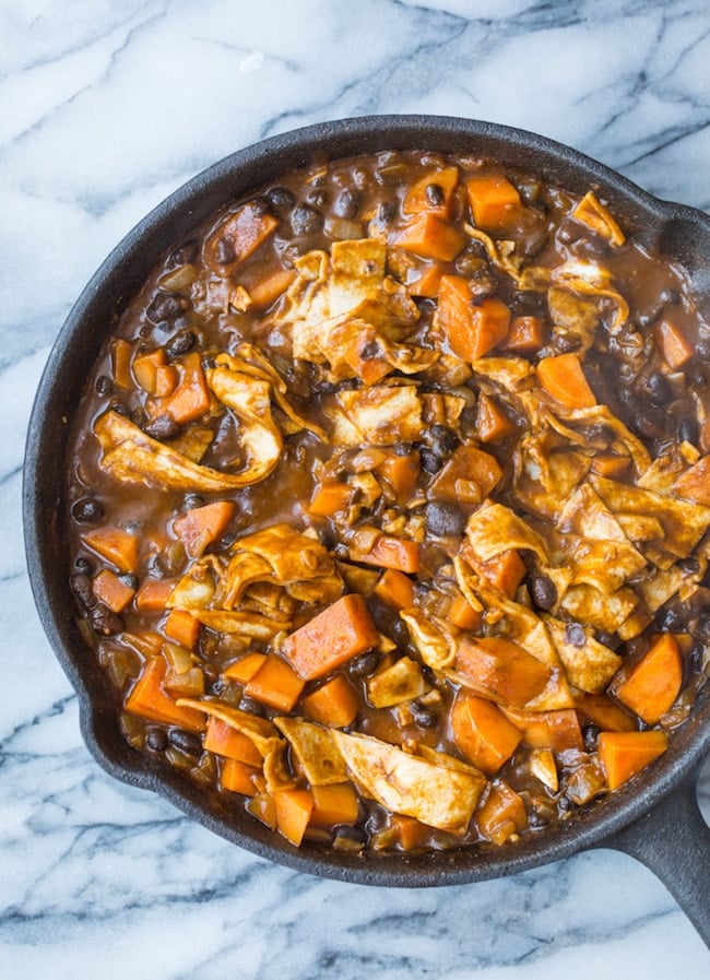 Sweet Potato & Black Bean Enchilada Skillet mixed together in a skillet before added cheese