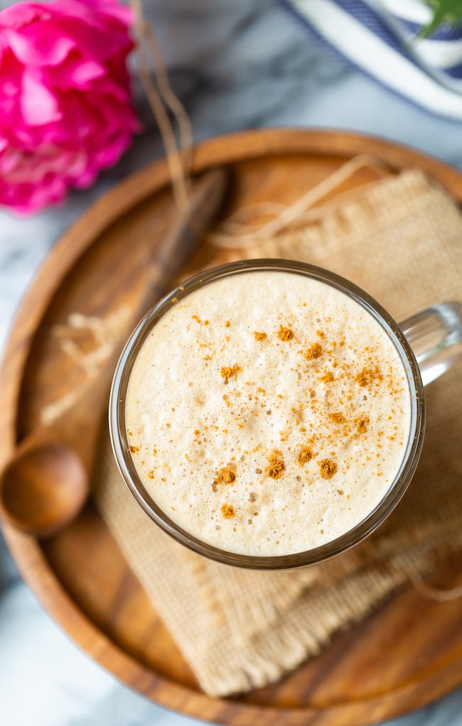 cashew butter latte foam top on a wooden plate