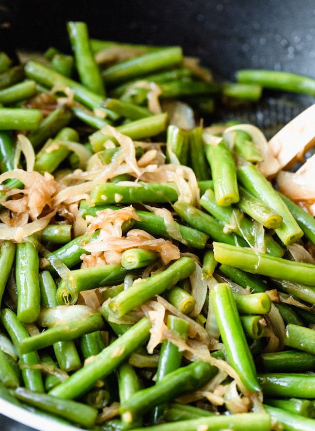 stir fried green beans in a wok