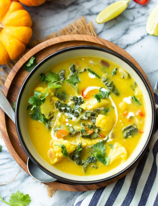 thai pumpkin soup in a bowl topped with cilantro