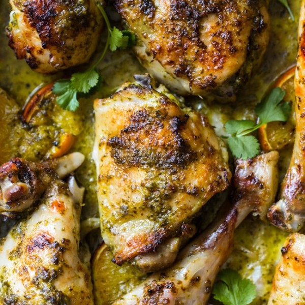 Herby One Pan Chicken with Oranges up close on a baking sheet