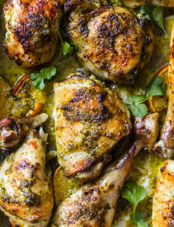 Herby One Pan Chicken with Oranges up close on a baking sheet