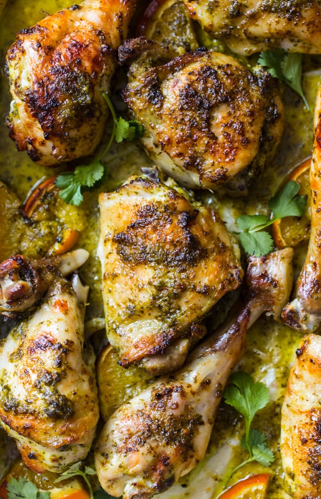 Herby One Pan Chicken with Oranges up close on a baking sheet