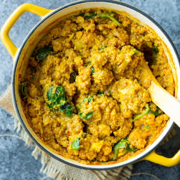 Golden Cauliflower Quinoa Curry in a yellow pot