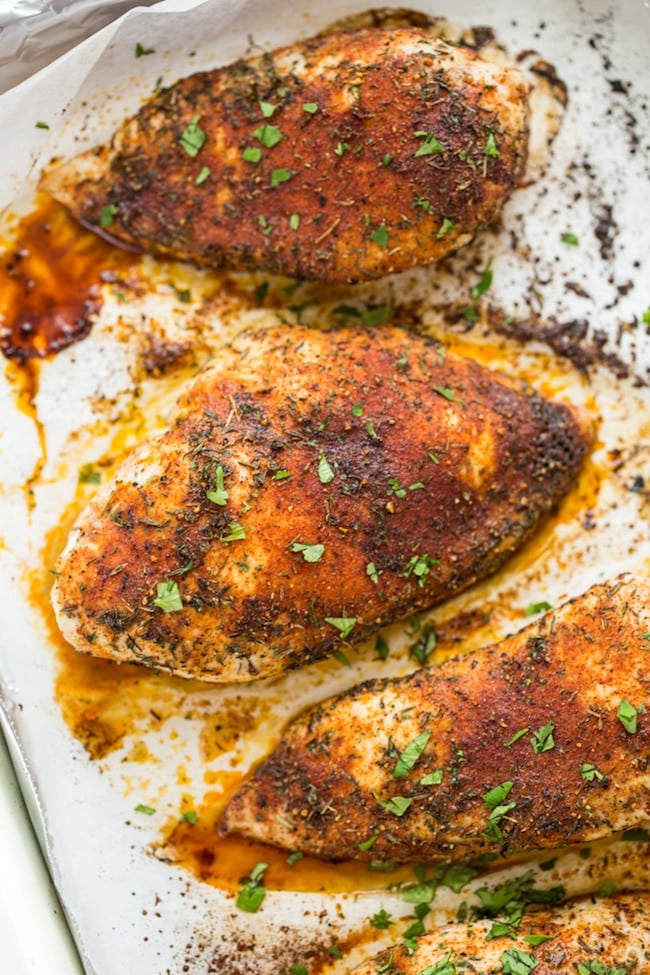 seasoned baked chicken breast topped with chopped cilantro 