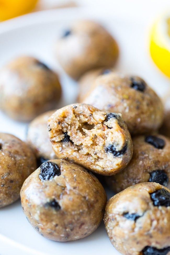 Blueberry Paleo Energy Balls with a bite take out