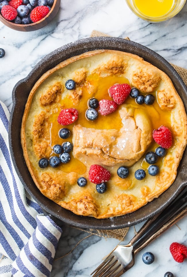 Gluten Free Dutch Baby topped with blueberries and raspberries
