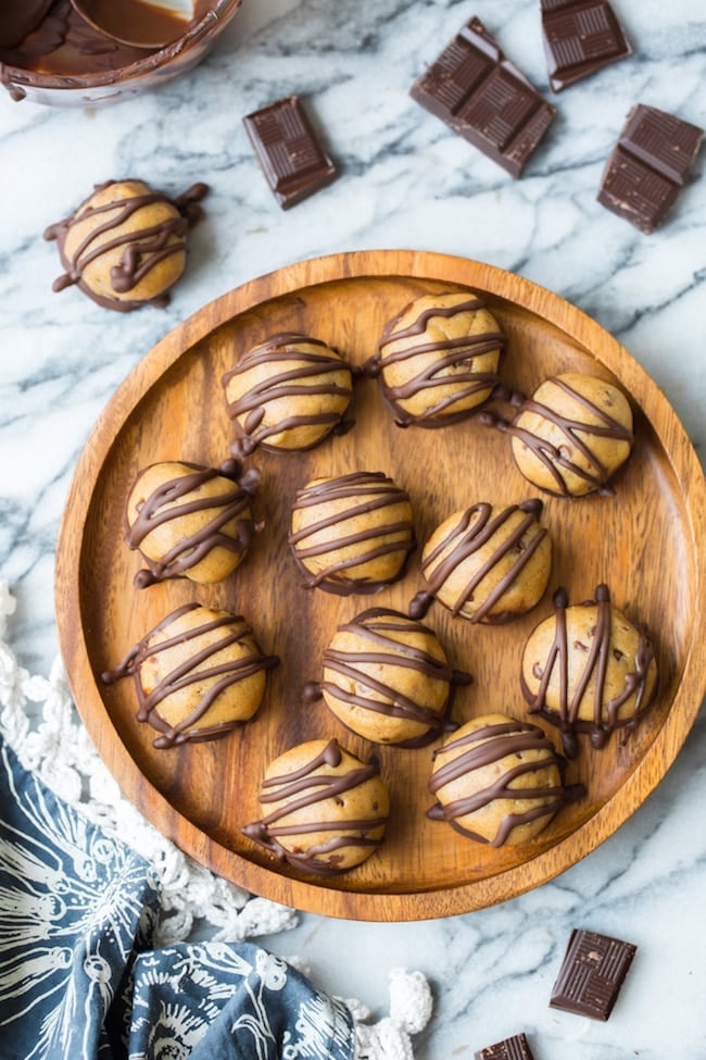 wooden plate filled with peanut butter truffles