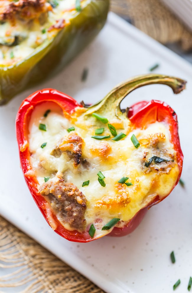 Breakfast Stuffed Bell Peppers on a plate topped with chives