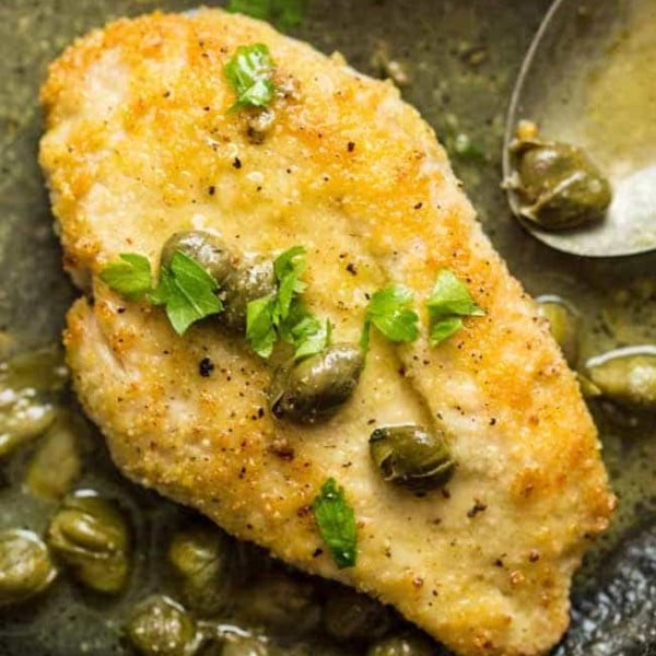 lemon caper chicken in a cast iron skilet