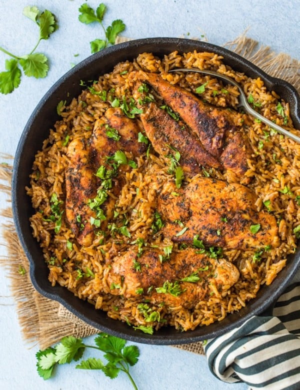 one pot chicken and rice in a cast iron skillet