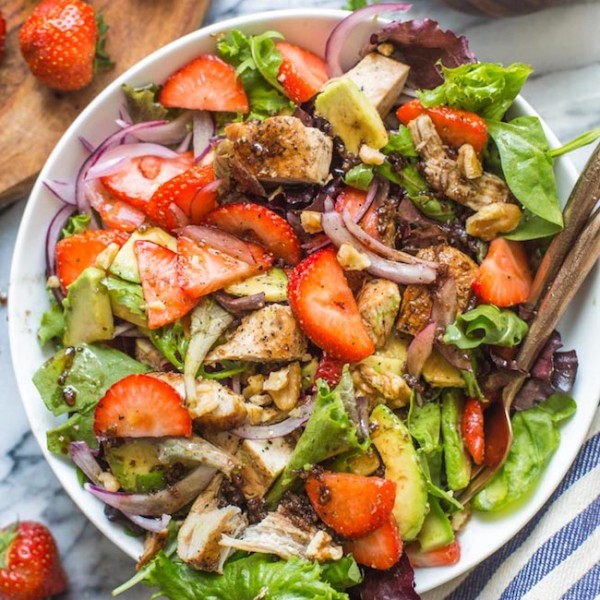 strawberry chicken salad in a bowl with forks