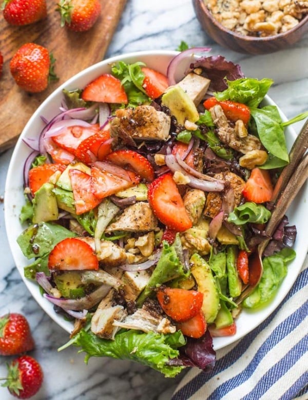 strawberry chicken salad in a bowl with forks