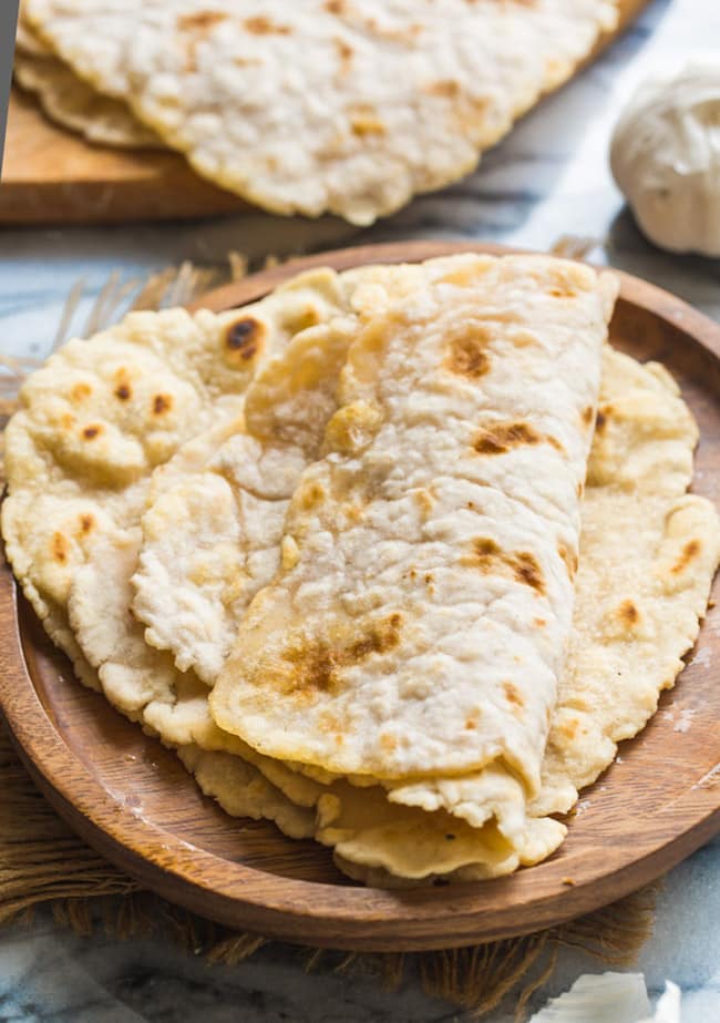 gluten free flatbread folded on a wooden plate