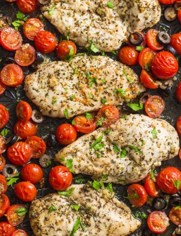 Italian Chicken with Cherry Tomatoes on a baking sheet