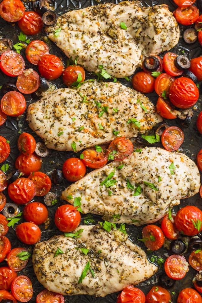 Italian Chicken with Cherry Tomatoes on a baking sheet