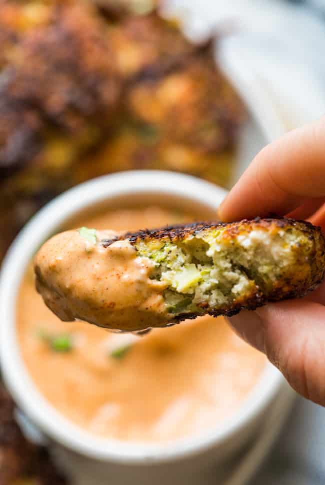 Chicken Broccoli Fritters dipped in sauce 