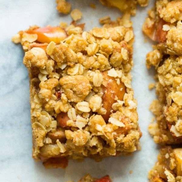 apple crumble bars on a marble surface