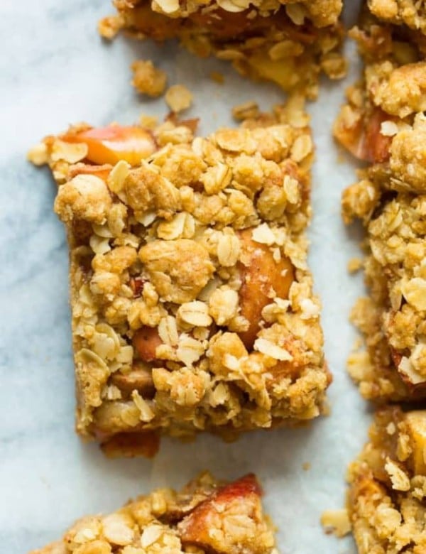 apple crumble bars on a marble surface