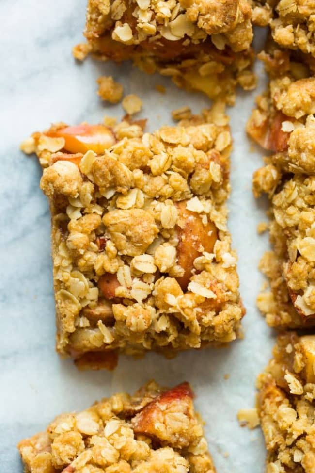 apple crumble bars on a marble surface