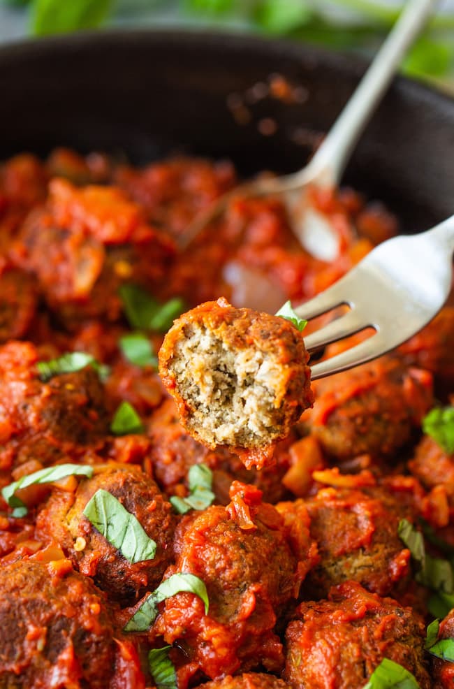 Vegan Lentil Meatballs on a fork with a bite taken out