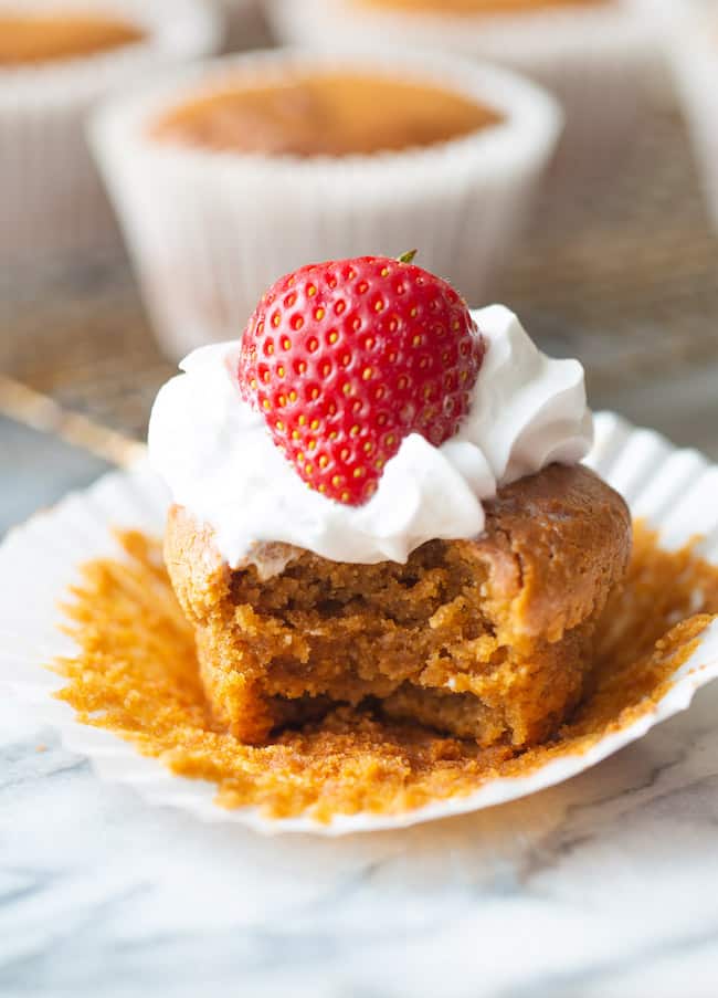 paleo vegan cupcakes topped with whipped cream