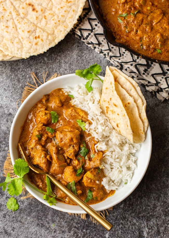 Butter Chicken Pumpkin Curry in a bowl with naan