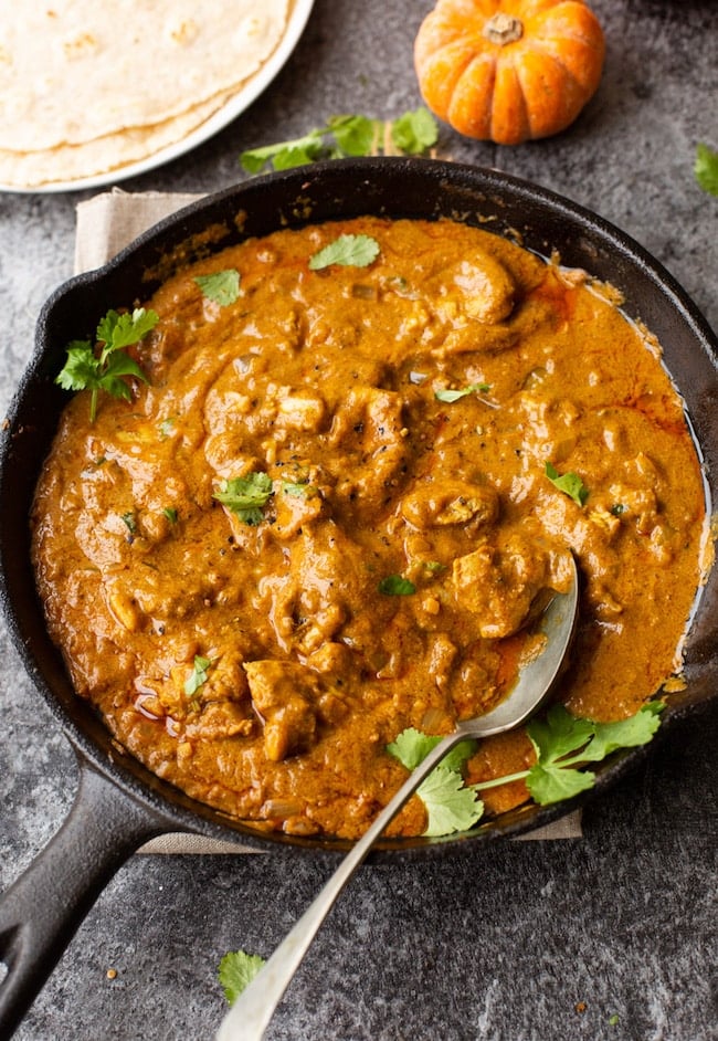 Butter Chicken Pumpkin Curry in a cast iron skillet